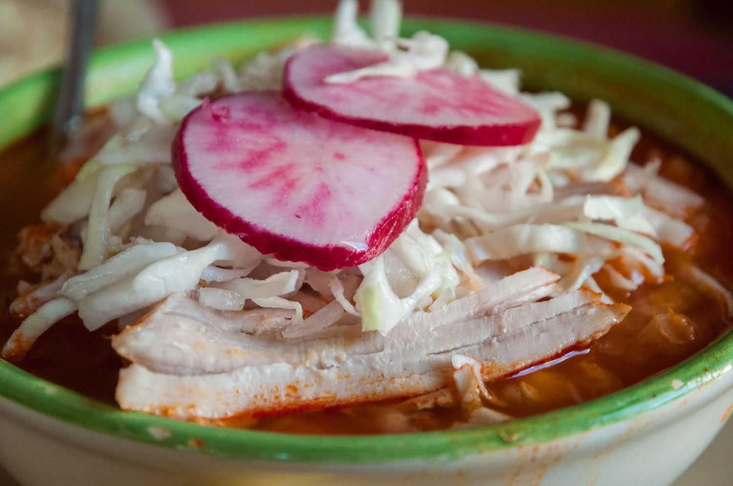 Pozole: pork stew with hominy corn in a tomato-chile base.