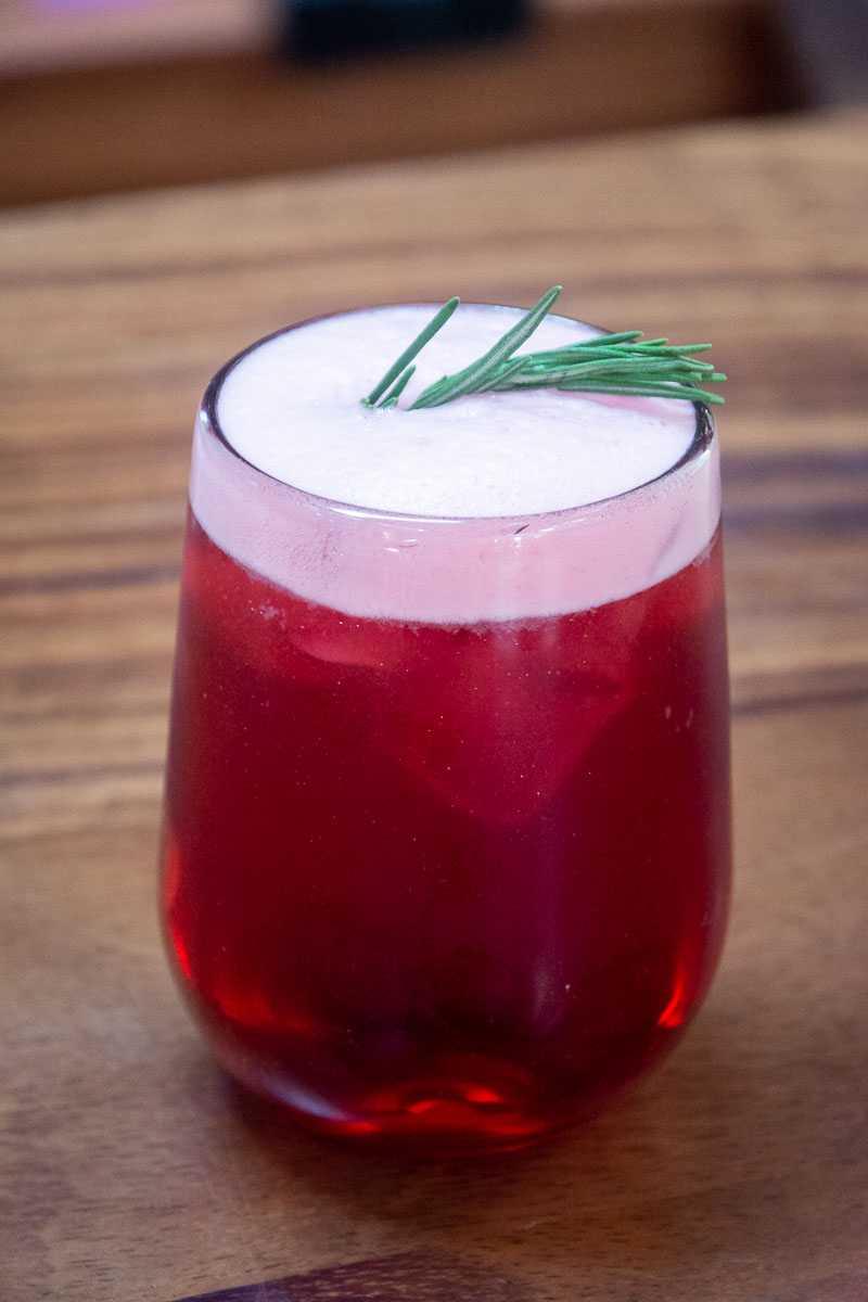 An agua fresca de jamaica with rosemary. Jamaica gets its color from its sole ingredient (besides water and sweetener), the hibiscus flower.