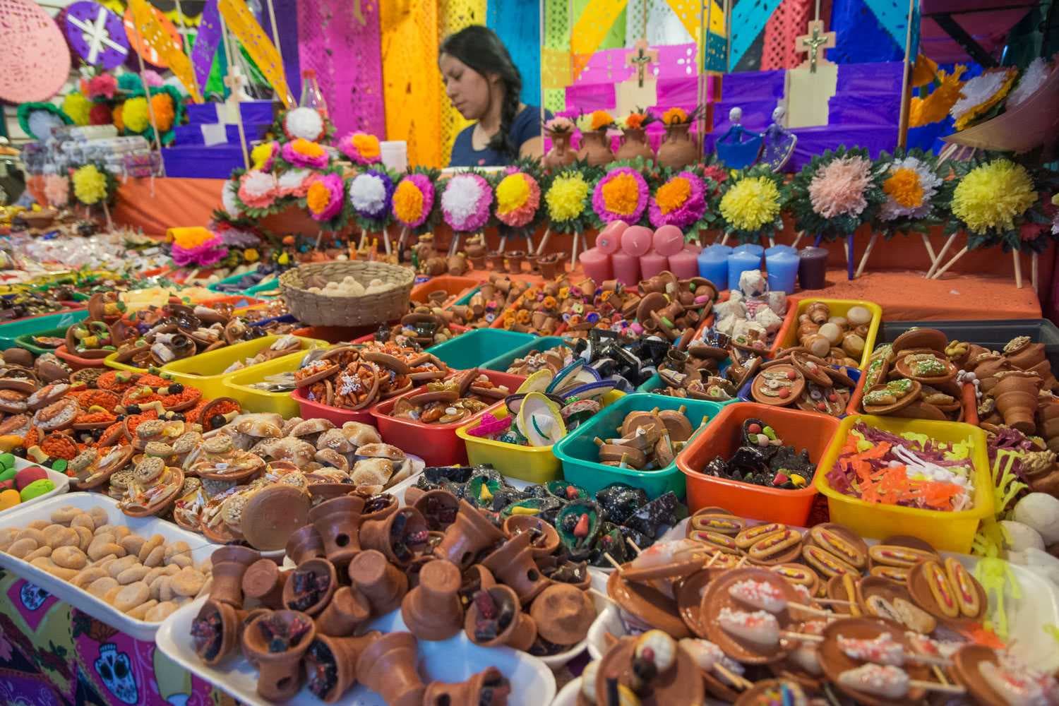 A vendor sells miniature objects for the altar at the Fería del Cartón in Guadalajara.