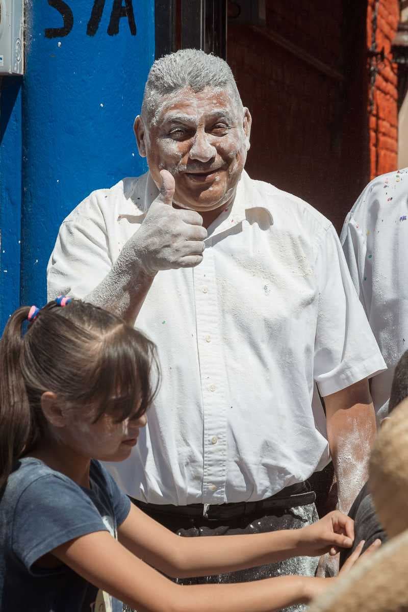 Owner Hector España after getting clobbered by flour during Ajijic's Carnival celebrations.