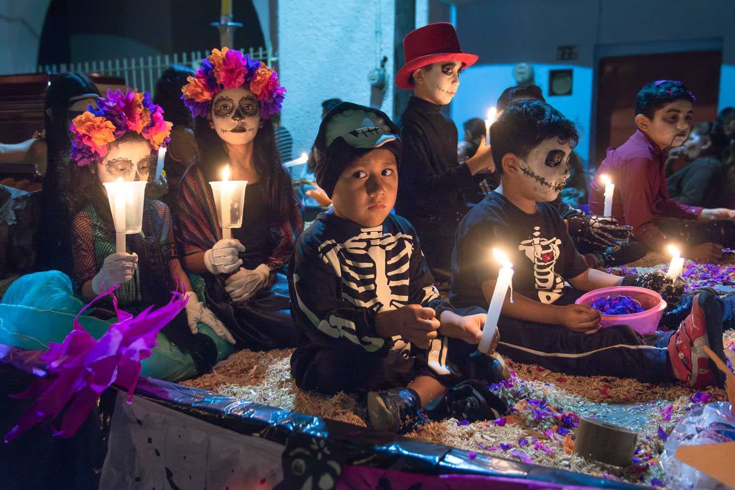 Kids ride a float during the Day of the Dead parade in Ajijic.