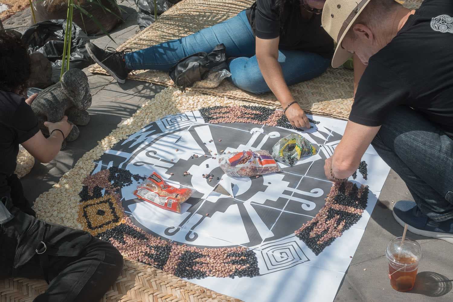 People create a tapete carpet from beans and seeds in the Ajijic plaza.